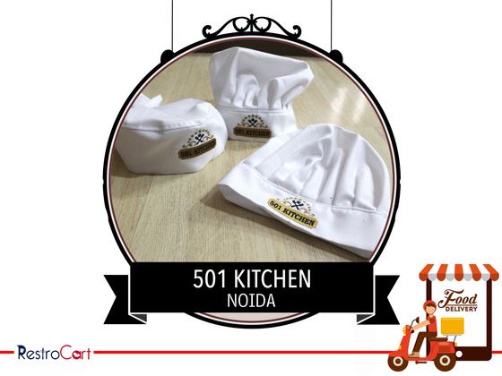 Three white pleated chef hats with gold and black logo patch, set on a wooden table, custom made for 501 Kitchen by RestroCart, New Delhi