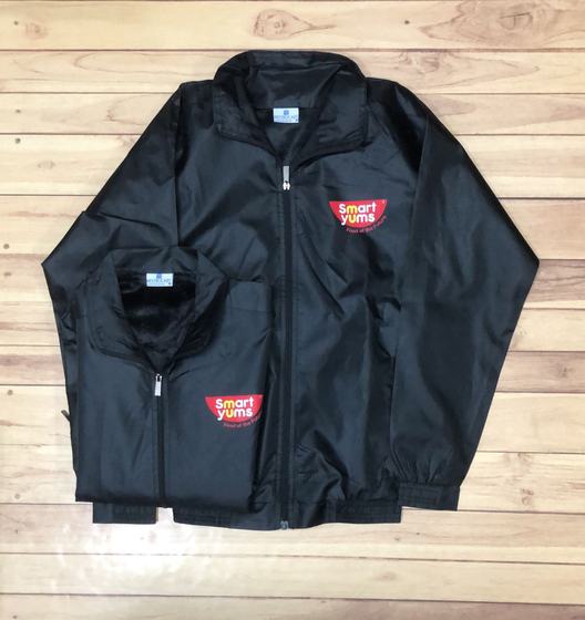 Black zip-up windcheaters with red printed chest logo, adult and folded pair, custom made by RestroCart, New Delhi