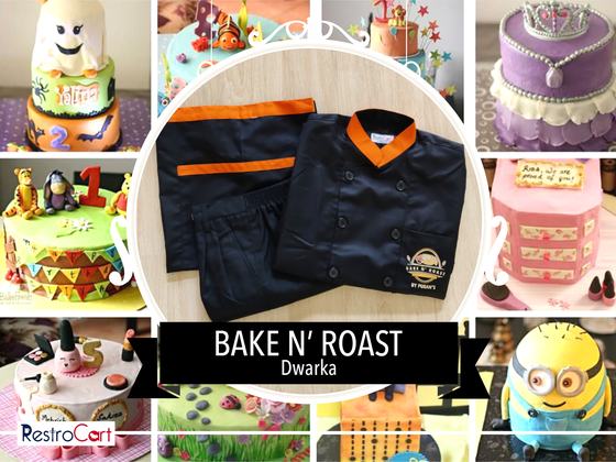 Black chef coat with orange collar and black trousers with orange trim, folded, custom made for Bake N Roast by RestroCart, New Delhi