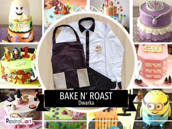White service shirt with black collar and dark brown bib apron with beige pockets, laid flat, custom made for Bake N Roast by RestroCart, New Delhi