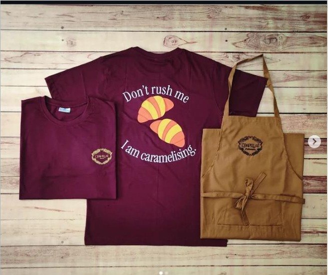 Maroon bakery t-shirts and brown embroidered aprons for a patisserie
