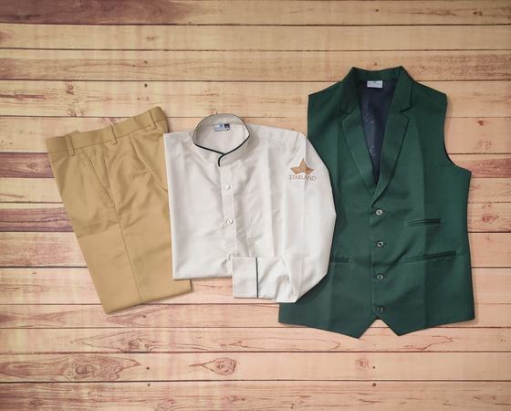 Cream mandarin collar shirt with gold logo, bottle green lapel waistcoat and khaki trousers, custom made by RestroCart, New Delhi