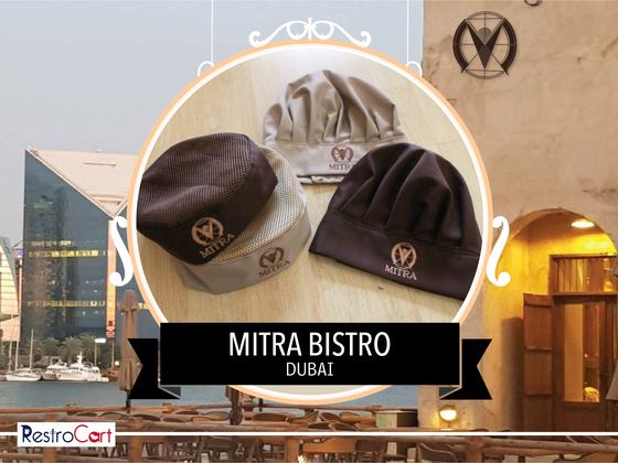 Three chef skull caps in brown, grey and black with embroidered logo, grouped together, custom made for Bistro Mitra by RestroCart, New Delhi