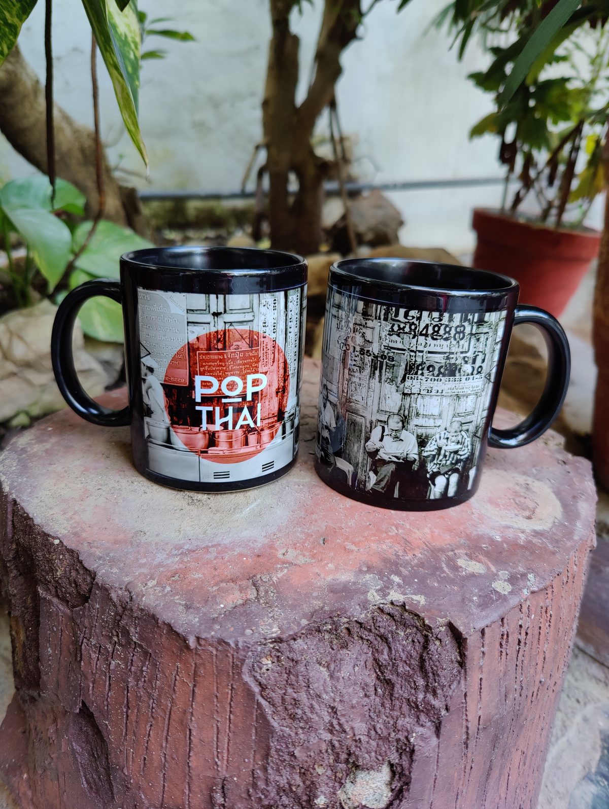 Black printed mugs for Pop Thai