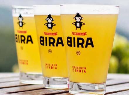 Three pint glasses of beer with printed monkey mascot and bold black logo, outdoor table, custom made by RestroCart, New Delhi