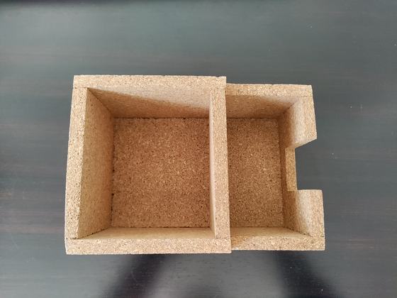Top view of a two-compartment cork caddy with slotted side section on a dark table, custom made by RestroCart, New Delhi