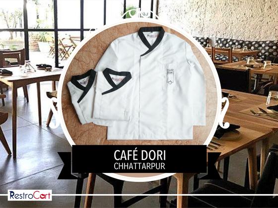 Two white chef coats with black crossover collars and small logo, one folded, one flat, custom made for Cafe Dori by RestroCart, New Delhi