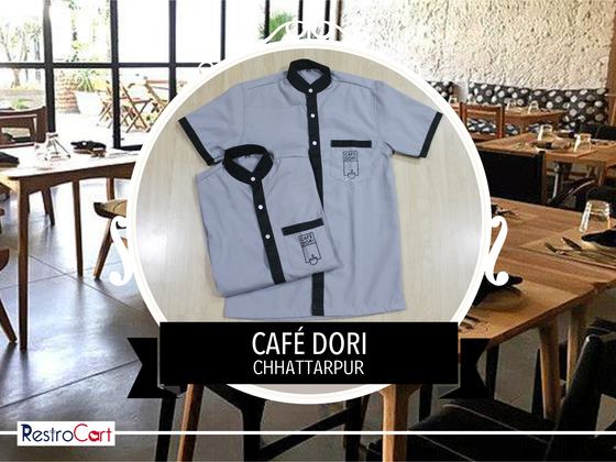 Light grey short-sleeve housekeeping shirts with black collar and trim, folded, custom made for Cafe Dori by RestroCart, New Delhi