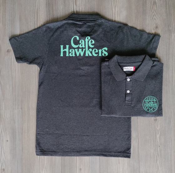 Charcoal polo t-shirts with mint green logo on back and round chest logo, custom made for Cafe Hawkers by RestroCart, New Delhi