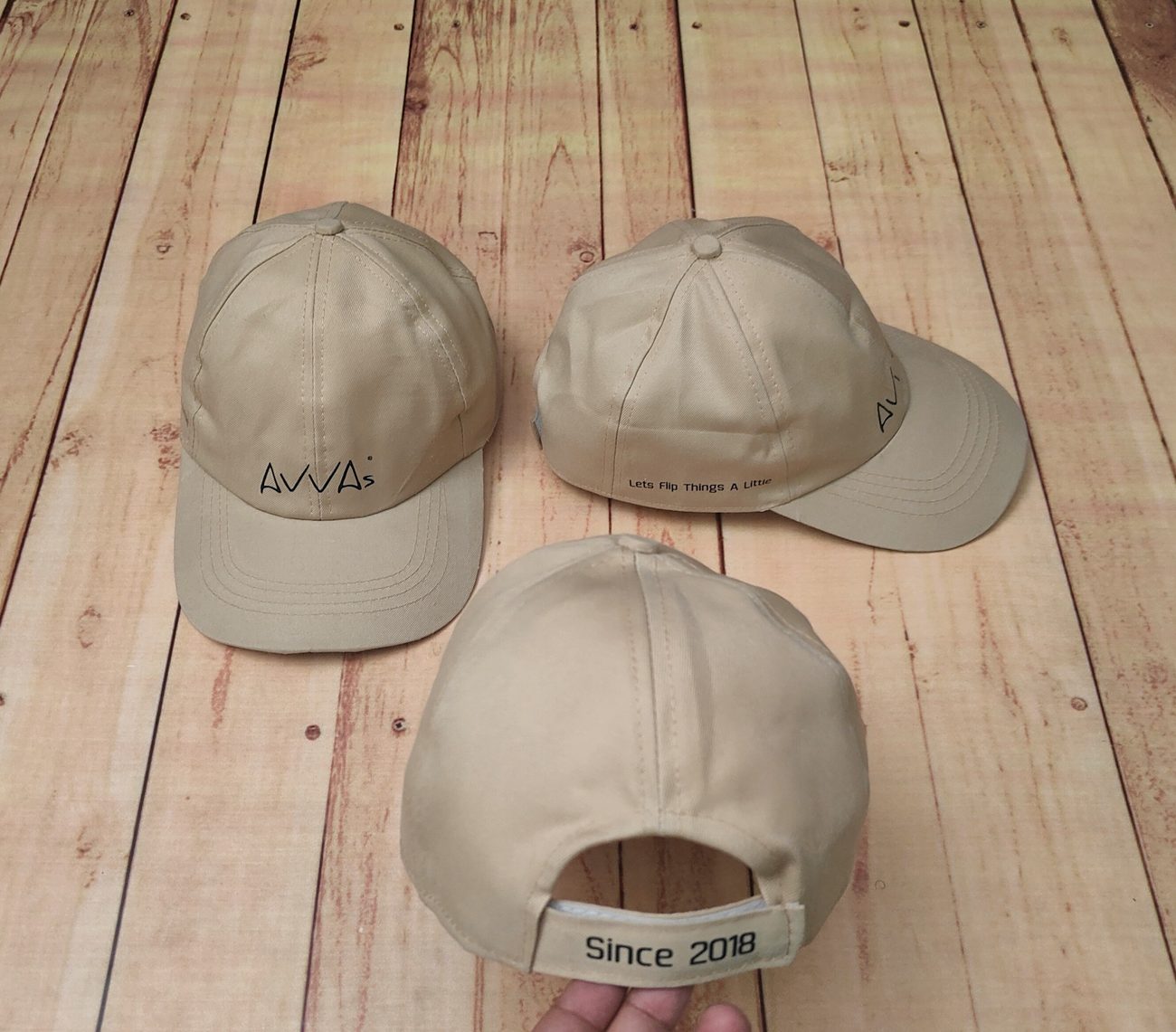 Custom embroidered baseball and newsboy caps for restaurant teams, made by RestroCart