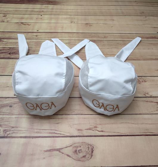 White mesh-sided chef skull caps with crossed back ties and tan printed wordmark, custom made by RestroCart, New Delhi