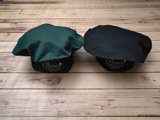 Green and black mushroom-top chef caps with black band and white printed logo, custom made by RestroCart, New Delhi
