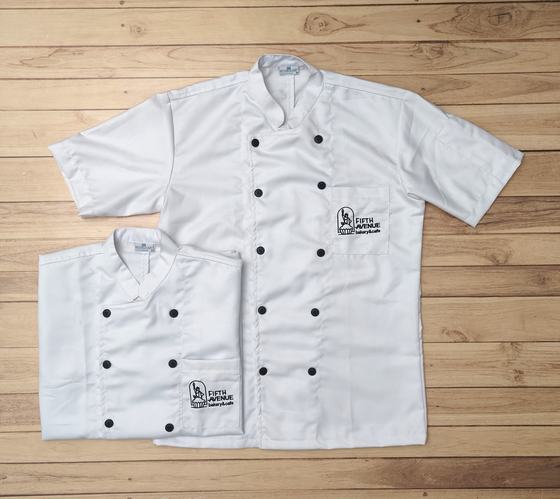 White short sleeve double breasted chef coats with black buttons and black printed chest logo, custom made by RestroCart, New Delhi