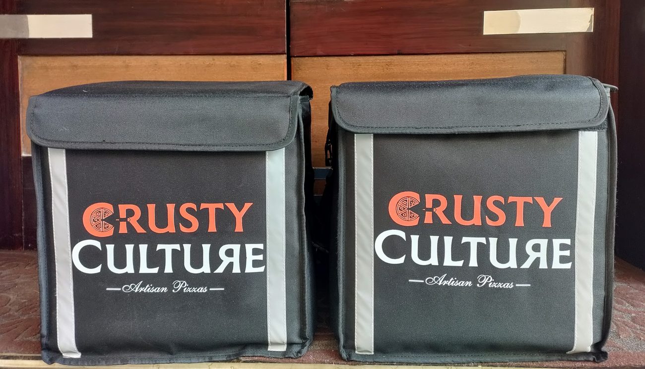 Custom branded insulated food delivery bags for cloud kitchens, made by RestroCart