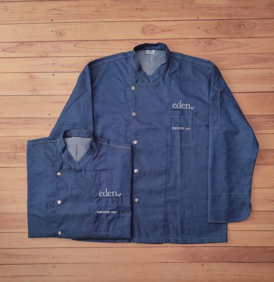 Blue denim full sleeve chef coats with grey collar lining and white embroidered logo, folded and flat, custom made by RestroCart, New Delhi