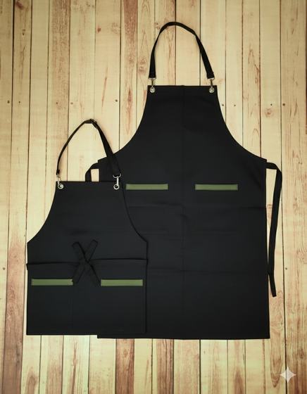 Black canvas bib and waist apron pair with olive green pocket trims and black straps, custom made by RestroCart, New Delhi