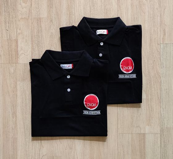Black polo t-shirts with round red embroidered chest logo, folded pair, custom made for Enoki Kitchen by RestroCart, New Delhi