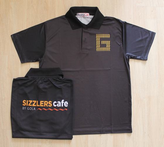 Black dry-fit polo with gold striped letter logo, folded one showing orange back print, custom made for Gola Sizzlers by RestroCart, New Delhi