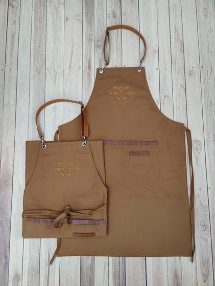 Golden brown canvas apron pair with leather straps and gold printed logo on the bib, custom made by RestroCart, New Delhi