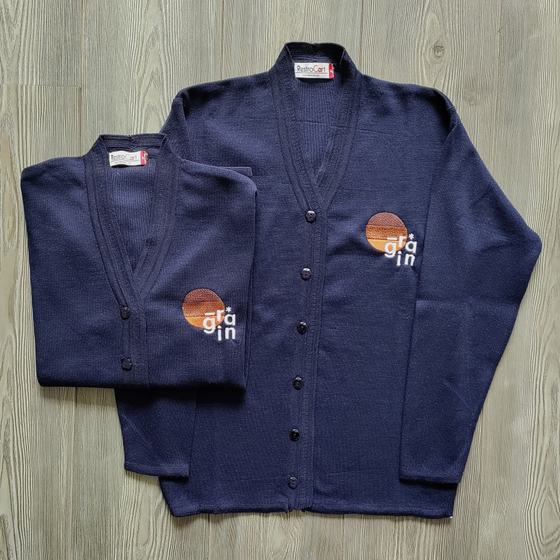 Navy knit cardigans with button front and colour-block round logo, two sizes, custom made for Grain by RestroCart, New Delhi