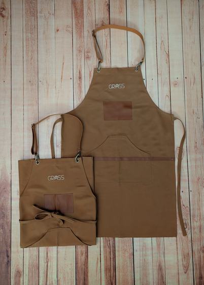 Brown canvas apron pair with leather straps, leatherette pocket patch and white text logo, custom made by RestroCart, New Delhi