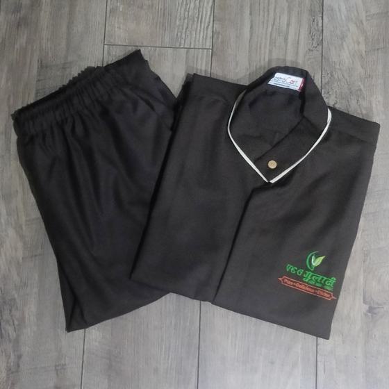 Black housekeeping tunic with white collar piping and green and red embroidered logo, with trousers, custom made for Gulati by RestroCart, New Delhi
