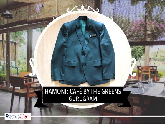 Teal green single-breasted blazer with notch lapels and small lapel badge, laid flat, custom made for Hamoni Cafe by RestroCart, New Delhi