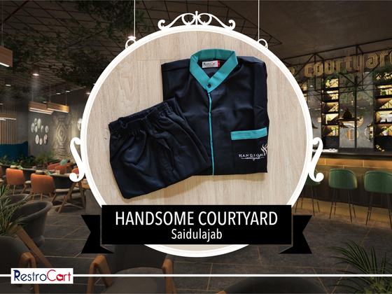 Navy housekeeping shirt with teal collar and pocket trim and navy trousers, folded, custom made for Handsome Courtyard by RestroCart, New Delhi