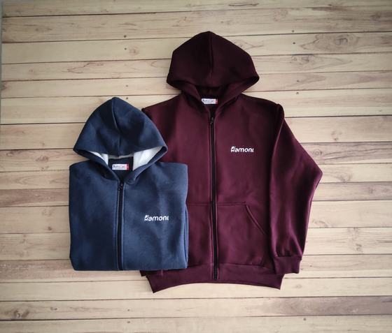 Navy and maroon hooded zip jackets with white printed chest logo and kangaroo pockets, custom made by RestroCart, New Delhi