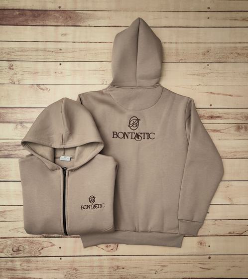 Beige fleece hoodies with brown embroidered logo, a zip-up folded and a pullover laid flat, custom made by RestroCart, New Delhi