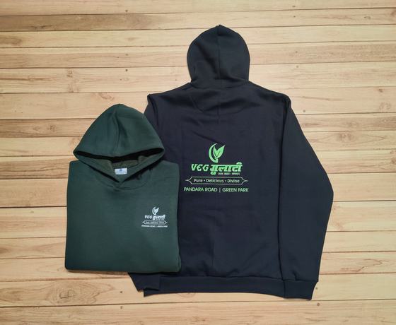 Navy hoodie with large green printed back logo and folded bottle green hoodie with chest logo, custom made by RestroCart, New Delhi