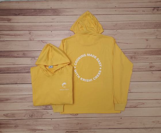 Mustard yellow hoodies with white circular slogan print on the back and small chest logo, custom made by RestroCart, New Delhi
