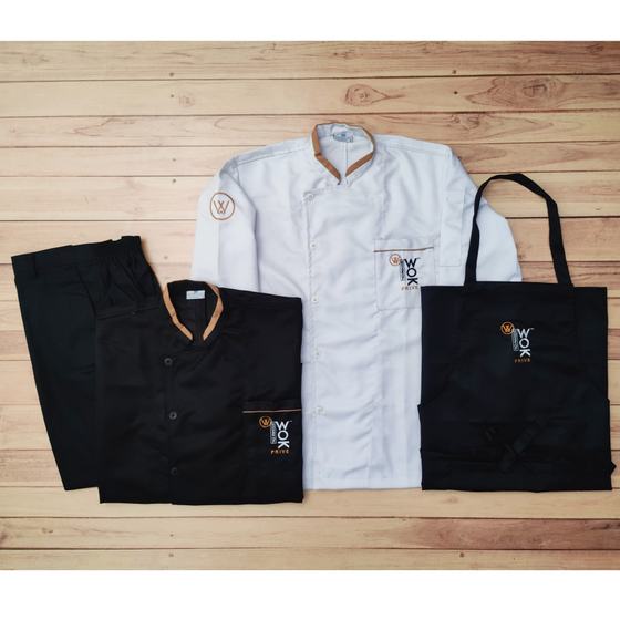 White and black chef coats with gold collar trim, black trousers and black bib apron, custom made for House of Wok Prive by RestroCart, New Delhi
