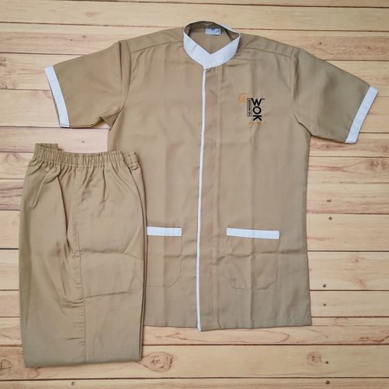 Beige half sleeve housekeeping tunic with white trim and matching trousers, logo on chest, custom made for House of Wok Prive by RestroCart, New Delhi