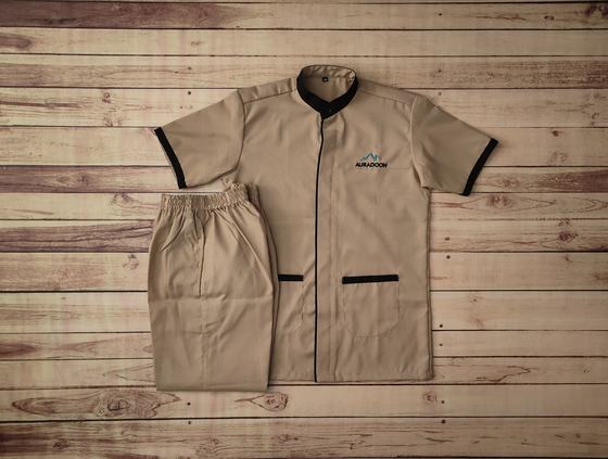 Khaki short sleeve tunic with black collar trim, blue mountain logo and khaki trousers, custom made by RestroCart, New Delhi