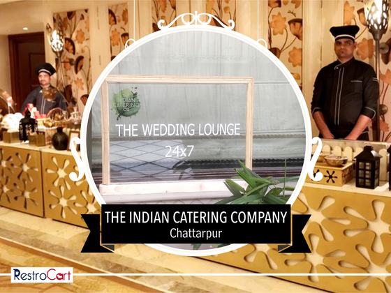 Clear glass sign board in a light wooden frame with printed logo and white lettering, custom made for Indian Catering Company by RestroCart, New Delhi