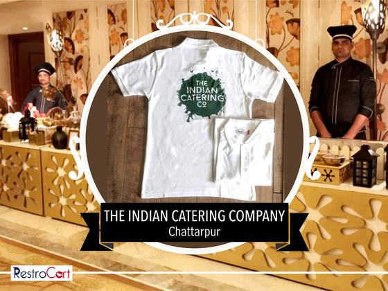 White t-shirts with large green splash logo print on the chest, one folded below, custom made for Indian Catering Company by RestroCart, New Delhi