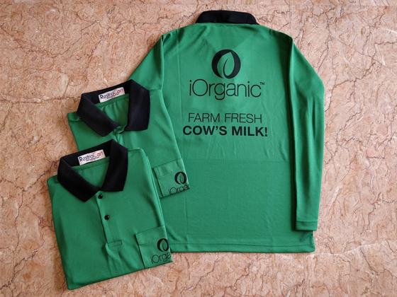 Green dry-fit polo t-shirts with black collar, long sleeve back print and folded pair, custom made for iOrganic by RestroCart, New Delhi