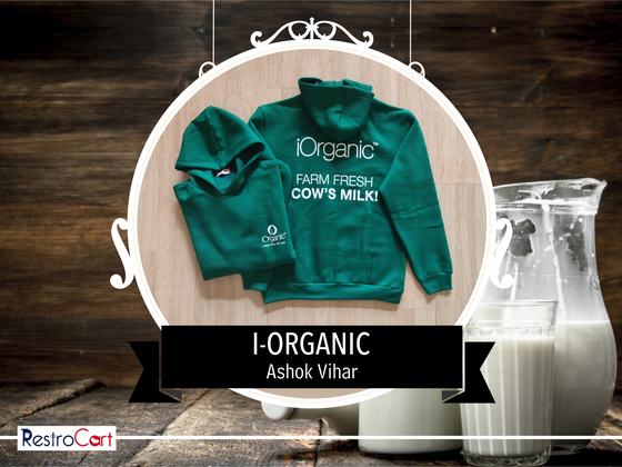 Two green hoodies with white printed logo and farm fresh slogan, laid flat, custom made for iOrganic by RestroCart, New Delhi