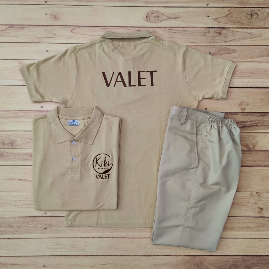 Beige valet polo t-shirts with VALET printed large across the back and a Kiki valet logo on the chest, with matching beige bottoms, made for Kiki Bar by RestroCart
