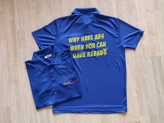 Royal blue dry-fit polo t-shirts with yellow kebab slogan printed on back, custom made for Kings Kebab by RestroCart, New Delhi