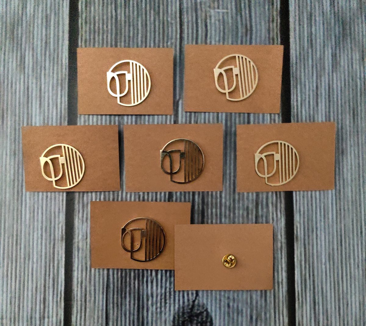 Tan leather patches with metal logos