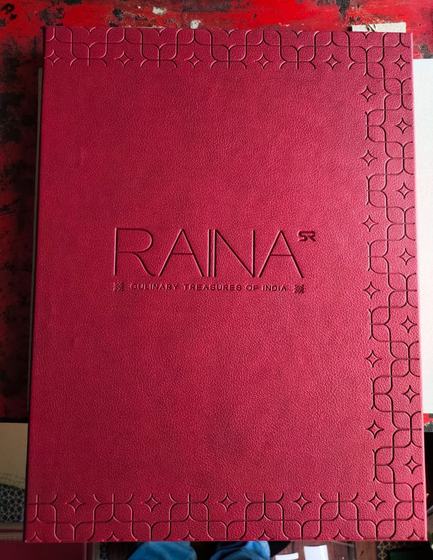 Crimson leatherette menu cover with debossed wordmark and embossed star pattern border, custom made by RestroCart, New Delhi
