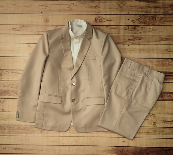Beige two button blazer with matching trousers and cream shirt, laid flat, custom made by RestroCart, New Delhi