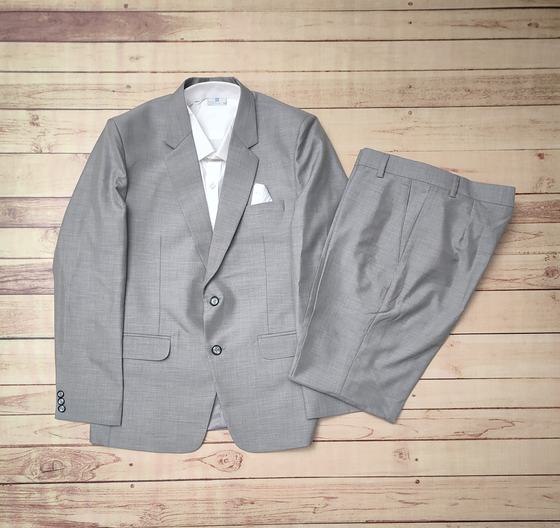 Light grey two button blazer with white pocket square, white shirt and grey trousers, custom made by RestroCart, New Delhi
