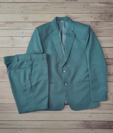 Teal two-button manager blazer with matching folded trousers, laid flat on wooden boards, custom made by RestroCart, New Delhi