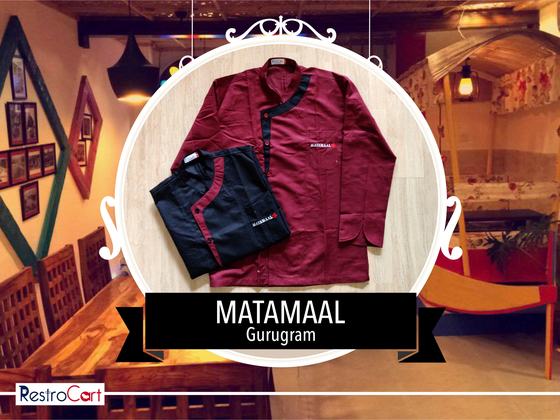 Maroon and black chef coats with contrast collar piping and small logo, laid flat, custom made for Matamaal by RestroCart, New Delhi