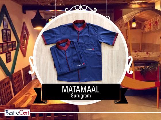 Blue short-sleeve housekeeping shirts with maroon collar and cuff trim and small logo, custom made for Matamaal by RestroCart, New Delhi