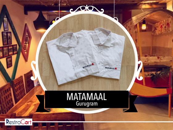 Two white collared manager shirts with small red embroidered logo, folded, custom made for Matamaal by RestroCart, New Delhi