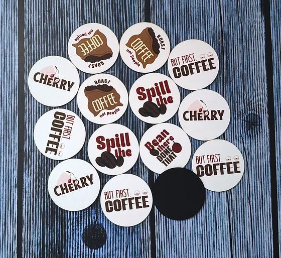 Round white MDF coasters printed with assorted coffee slogans in black and brown, custom made by RestroCart, New Delhi